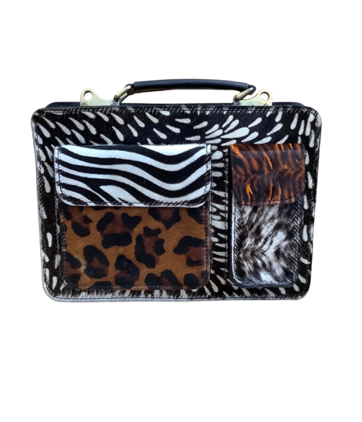 Cartera de piel animal print con pelo natural y cremallera